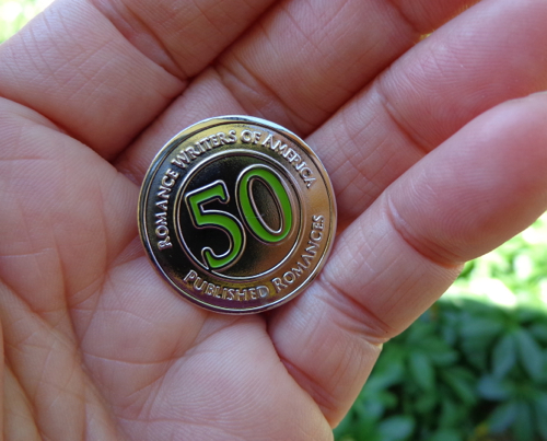 Deborah Cooke's 50 books published pin from RWA