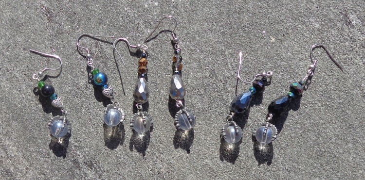 Dragon claw drop earrings with glass beads made by Deborah Cooke