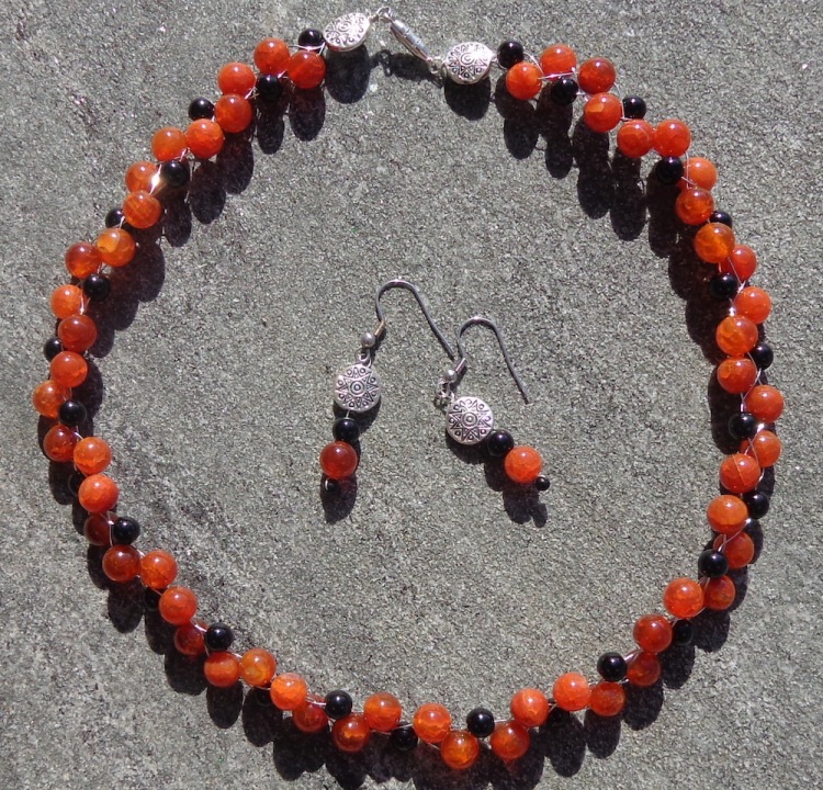 Fire agate necklace and earrings made by Deborah Cooke