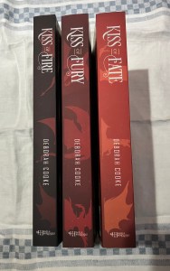 spines of the trade paperback editions of the Dragonfire Novels by Deborah Cooke