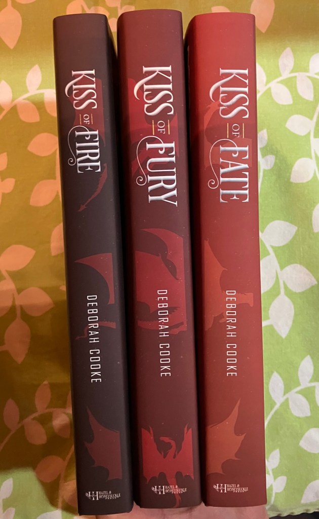 spines of jacketed hardcovers of the Dragonfire Novels