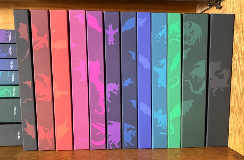 new hardcover editions of the Dragonfire Novels by Deborah Cooke, on the shelf, without jackets